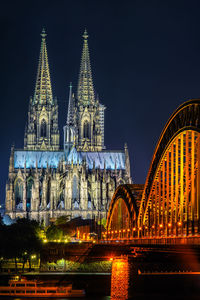 Illuminated cathedral against sky at night