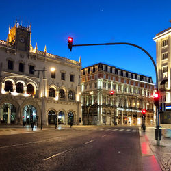 View of buildings in city at dusk