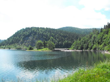 Scenic view of lake with mountains in background