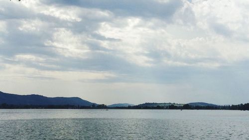 Scenic view of sea against cloudy sky