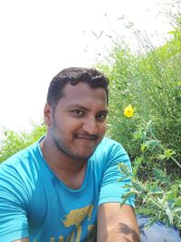 Portrait of smiling man on field