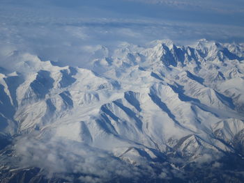 Scenic view of snowcapped mountains against sky