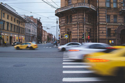 Blurry cars ride on the city road