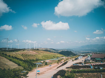 Road by landscape against sky