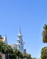 Low angle view of building against clear blue sky