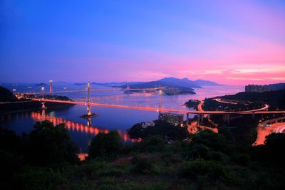 High angle view of bridge over river at night