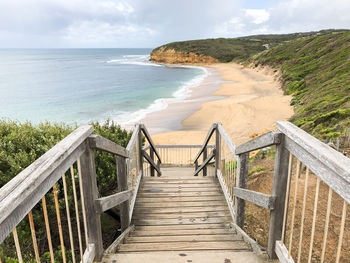 Staircase leading towards sea against sky. bells beach