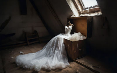 Old wedding dress stored in the attic, ai generated