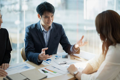 Business colleagues working at office