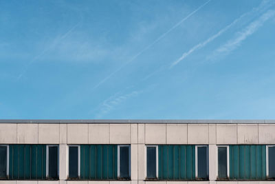 Low angle view of building against blue sky