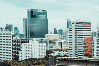 Skyscrapers in city against sky