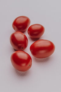 High angle view of tomatoes on white background