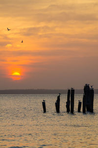 Scenic view of sea against sky during sunset