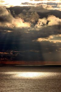 Scenic view of sea against dramatic sky