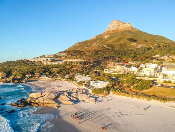 Drone evening view of lion's head mountain in cape town, south africa, seen from camps bay beach.