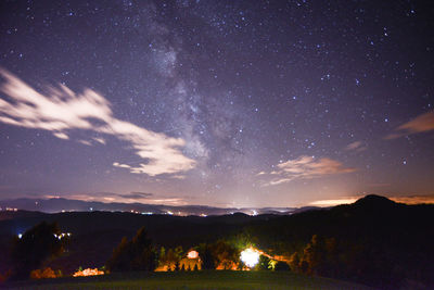 Scenic view of illuminated star field against sky at night