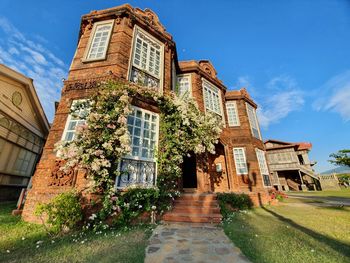 Low angle view of old building against sky