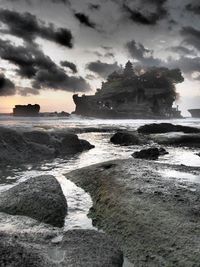 Scenic view of sea against cloudy sky