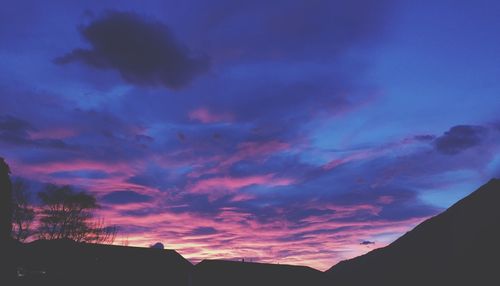 Low angle view of dramatic sky during sunset