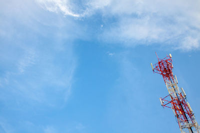 Low angle view of communications tower against sky