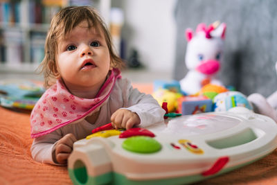 Close-up of cute boy playing with toy blocks on table