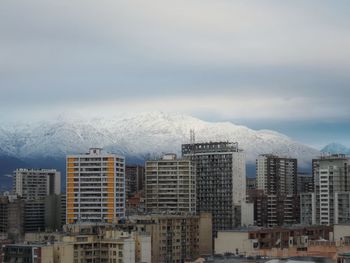 Cityscape against sky during winter