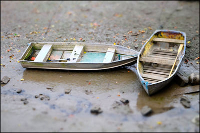 Tilt-shift image of boats at sandy beach