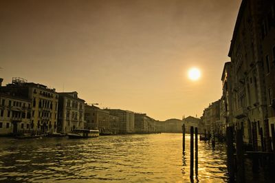 Built structures in water at sunset