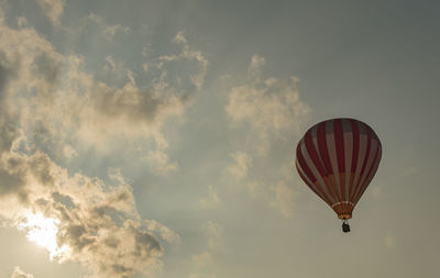 Low angle view of hot air balloon against sky during sunset