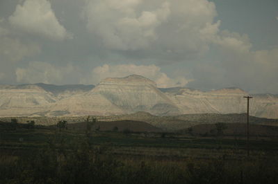 Scenic view of landscape against cloudy sky