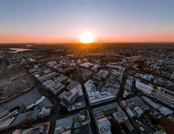 High angle view of townscape against sky during sunset