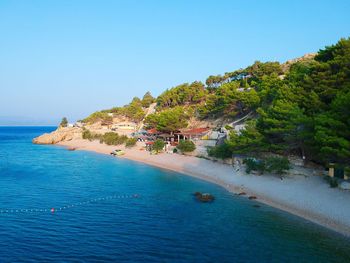 Scenic view of sea against clear blue sky