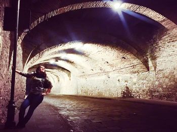 Man standing in tunnel