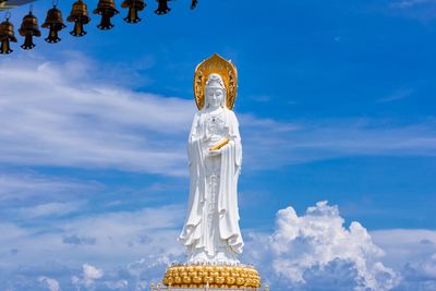 Low angle view of statue against sky