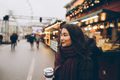 Happy woman at the christmas market. new year celebration