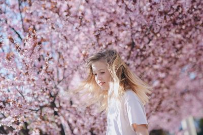 Side view of girl standing on field