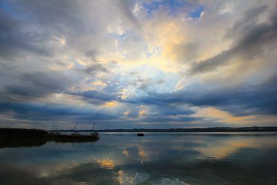 Scenic view of lake against sky during sunset