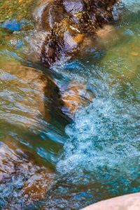 High angle view of water flowing over sea