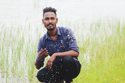 Young man standing on field