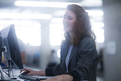 Embloyee in an office smiling