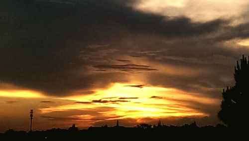 Low angle view of cloudy sky at sunset