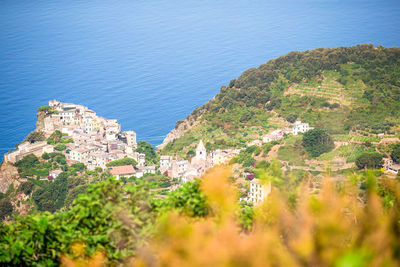 High angle view of buildings by sea