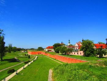 Scenic view of field against clear blue sky