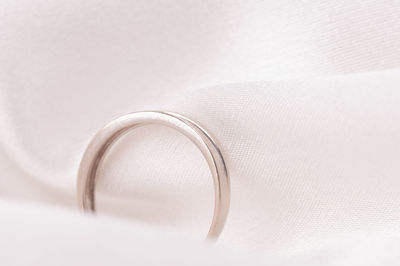 Close-up of wedding rings on white background