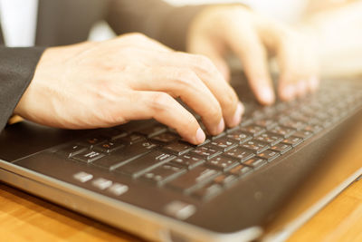 Close-up of man using mobile phone