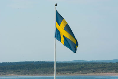 American flag against blue sky