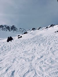 Scenic view of snow covered mountain against sky