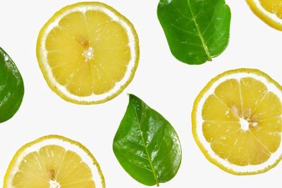 Close-up of lemon slice against white background