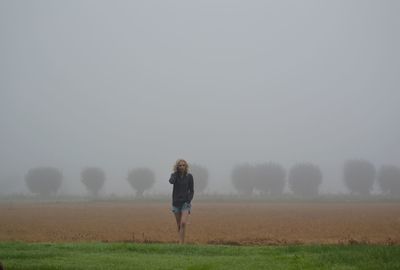 Full length of woman on field