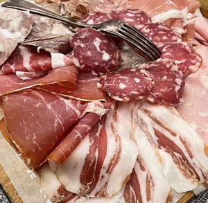 Tray with typical italian salami. platter of assorted cured meat.